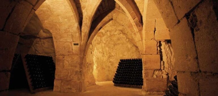 Taittinger Champagne bottles in Chalk Cellars of Reims, France