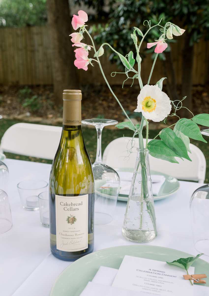 Flowers and wine on table