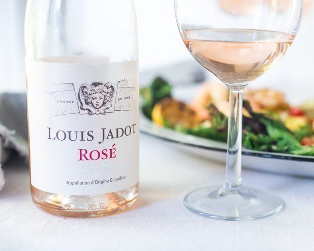 Rose wine in glass and bottle