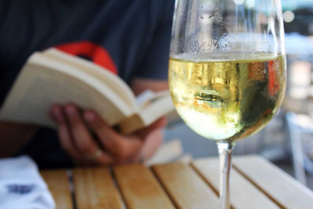 Wine and book by Quinn Dombrowski