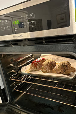 Three loaves of meatloaf in oven
